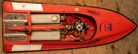 A multi-racer pond boat with orange fibreglass body and fitted with a 3.5cc Novarossi glow plug (