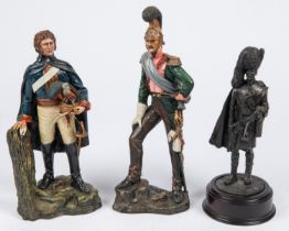 A resin figurine of a Royal Horse Guard 1815, 9½"; another of a French Napoleonic Dragoon, 10½";
