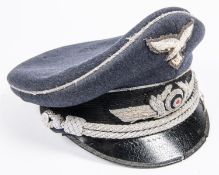 A Third Reich Luftwaffe officer's SD cap, alloy embroidered cords and badges, maker's marks and 1940
