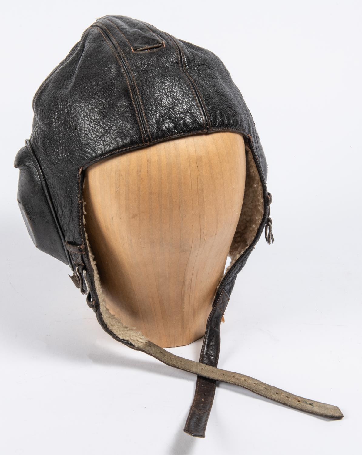 A WWII period leather flying helmet, with rubber ear cups and sheepskin lining. GC £80-100 - Image 4 of 4