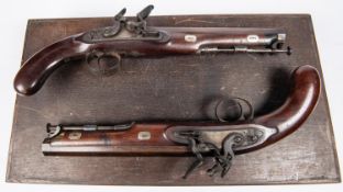 A good quality pair of officer's 16 bore flintlock holster pistols by "J.No. Jones & Co",