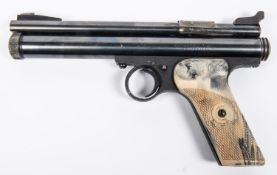 A .22" Crosman Model 150 CO2 pistol, with mottled white plastic grips. GC, retaining nearly all