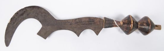 A central African throwing knife, possibly North Cameroons, engraved blade 16”, turned wood