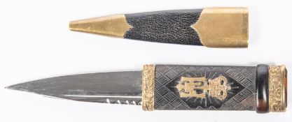 A good Skean Dhu sock knife, polished blade 3¼", carved wood hilt with Cairngorm pommel, gilt mounts