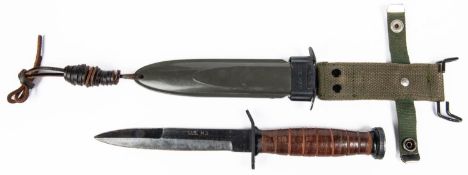 A US Army M8A1 fighting knife, blade 6½" marked "US M3", in its sheath. VGC £30-50