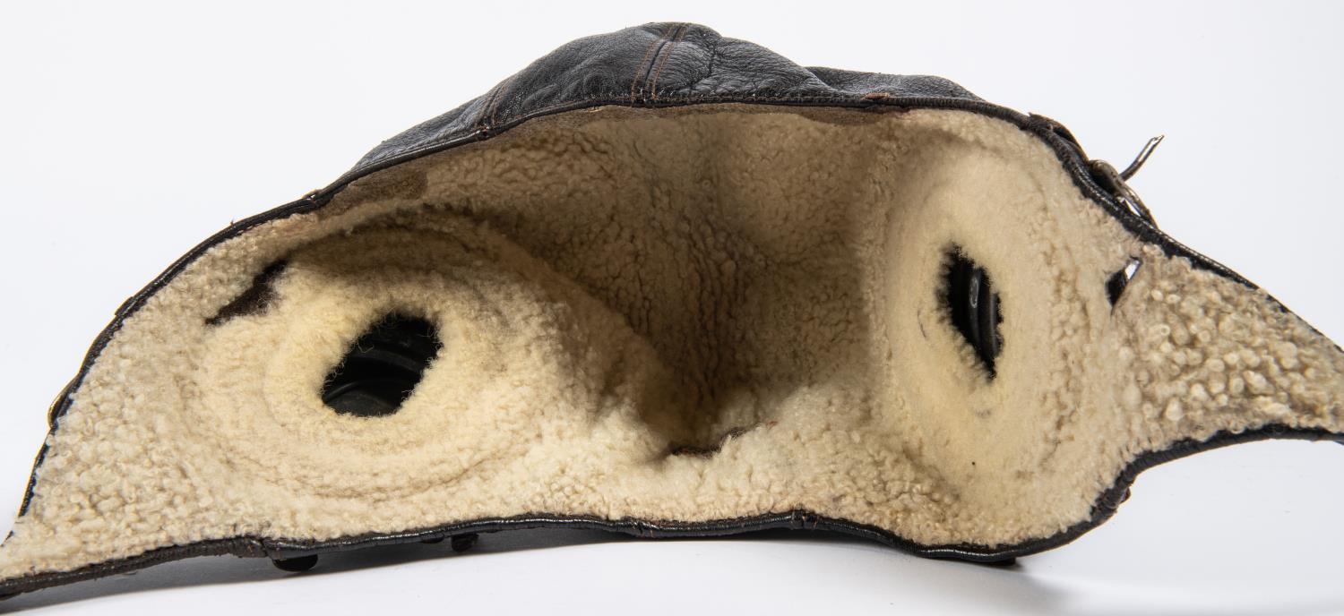 A WWII period leather flying helmet, with rubber ear cups and sheepskin lining. GC £80-100 - Image 3 of 4