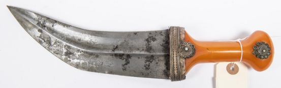 An Arab jambiya, blade 7¾” with central rib, amber handle with WM mounts. GC £70-80