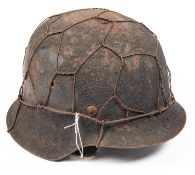 A scarce WWII Third Reich 1943 pattern steel infantry helmet, with much original sanded finish and
