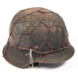 A scarce WWII Third Reich 1943 pattern steel infantry helmet, with much original sanded finish and