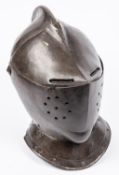 A good old copy of a close helmet, c 1600, of heavy construction, the skull and low comb formed in
