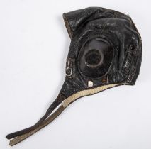 A WWII period leather flying helmet, with rubber ear cups and sheepskin lining. GC £80-100