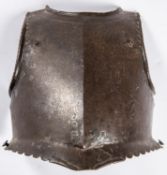 An early 17th century officer’s breastplate, with rolled neck, scalloped borders, separate roped