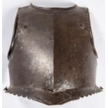 An early 17th century officer’s breastplate, with rolled neck, scalloped borders, separate roped