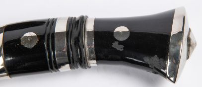 A Gurkha kukri, plated blade 12", horn hilt with plated mounts, in its black leather covered