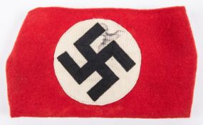 A Third Reich NSDAP arm band with applied swastika motif. GC £200-250