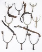 Four pairs of military pattern spurs: pair large steel by Andrews of Oxford, with leather straps and