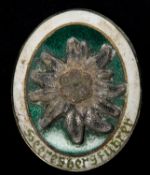 A Third Reich Mountain Troops enamelled breast badge, "Heeres Burgfuhrer", engraved on back with