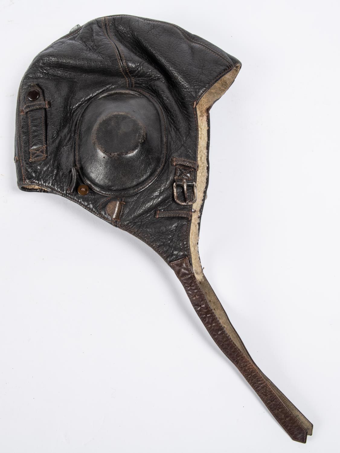 A WWII period leather flying helmet, with rubber ear cups and sheepskin lining. GC £80-100 - Image 2 of 4