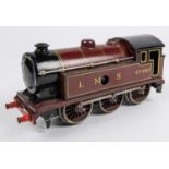 A Bing O gauge clockwork LMS 0-6-0T locomotive, 47480, in lined maroon livery. Bing logo to rear