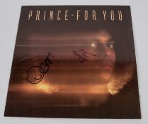 A Prince LP record album, For You. Signed to the cover by band members Cat Glover and Matt Fink (