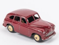 A scarce Dinky Toys Standard Vanguard (40e). An example in maroon with open rear wheel arches,