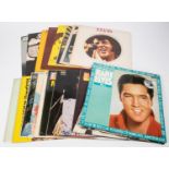 24x Elvis Presley LP record albums, etc. Including; The First Live Recordings. 14 Golden Hits. 10"