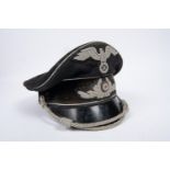 A Third Reich Diplomatic officer's SD cap, alloy embroidered cords and badges, black velvet band,