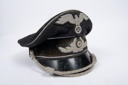 A Third Reich Diplomatic officer's SD cap, alloy embroidered cords and badges, black velvet band,