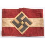 A Third Reich Hitler Youth red and white armband, with applied swastika motif and gilt central