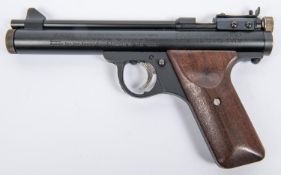 A .22" Crosman E9A series CO2 pistol, number 14443, with matt black finish and plain walnut grips.
