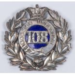 A pre 1881 silver badge of the 108th Madras Infantry, with blue enamel backing to the centre, and