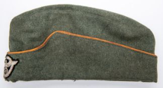 A Third Reich OR's Police FS cap, orange piping, woven wreathed eagle badge. GC (some mothing). £