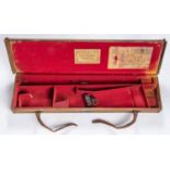 A leather bound canvas covered case for a DB gun with 30" barrels, red felt lined with all