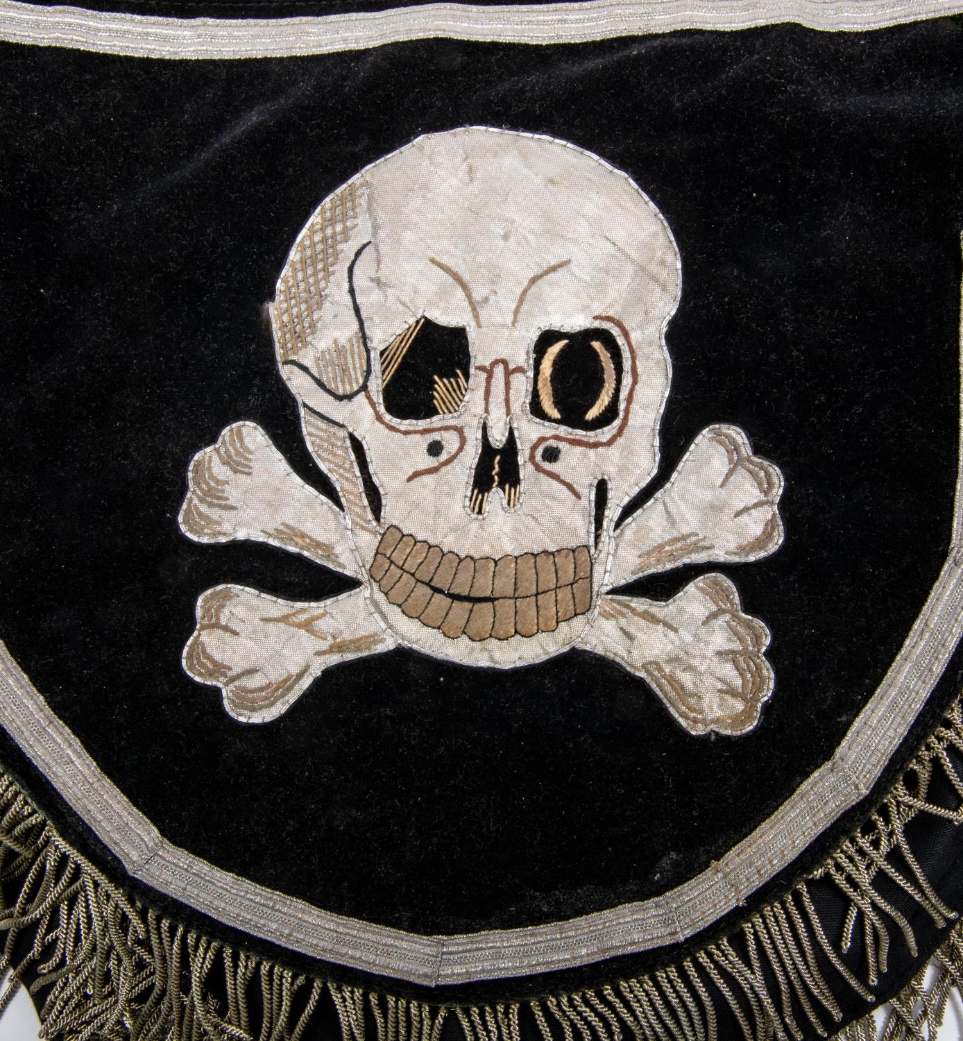 A Third Reich black velvet kettle drum cover, decorated with silver alloy braid skulls and eagle - Image 2 of 4