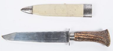 A 19th century Bowie knife, plain blade 7" with scalloped back edge, the hilt of staghorn with