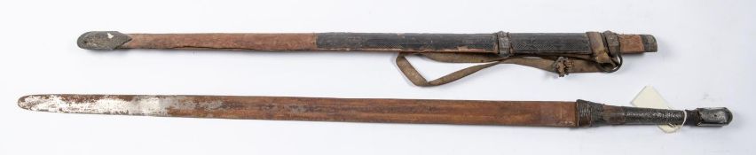 An Omani sword Kattara from Zanzibar, double edged blade 30" (very rusty), the grip bound with