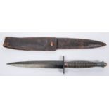 A WWII Third Pattern FS knife, blade 6¼", ribbed hilt, GC (blackened finish worn) with an