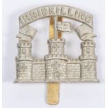 A scarce white metal cap badge of the Inniskilling Fusiliers, c 1926-1934. GC £30-50