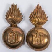 An OR's pugaree grenade of the Inniskilling Fusiliers, with vertical pin fitting; and another