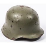 A WWII vintage Spanish Army steel helmet, leather lining, olive drab finish. GC (some chips to