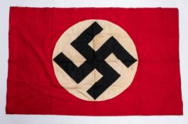 A good Third Reich party flag, 42" x 29", of red material with applied swastika motif. VGC £80-100