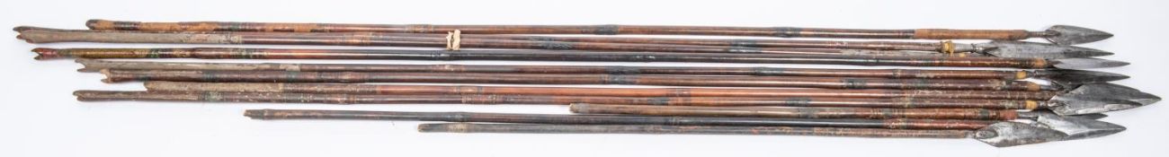 Eleven 18th century Indian arrows with broad flat leaf shaped blades, including a matching pair,