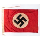 A Third Reich flag of stitched construction, 35" x 23", stamped "N.S.D.A.P" and 1935. GC £65-70