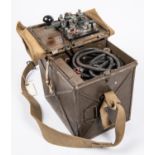 A WWII British Army Electric Morse signalling lamp, in its steel and webbing case complete with 4