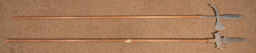 A Partisan, length 84", steel blade stamped "1673"; also a similar halberd, both with turned wood