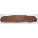 A Western Australian Aborigine wooden shield "Woonda", 31" x 6" wide, decorated overall with