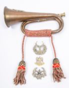 A copper bugle, mounted with a cast brass badge of the Argyll & Sutherland Highlanders, with