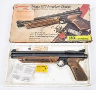 A .177" Crosman American Classic model 1377 pneumatic air pistol, number 279025527, with brown