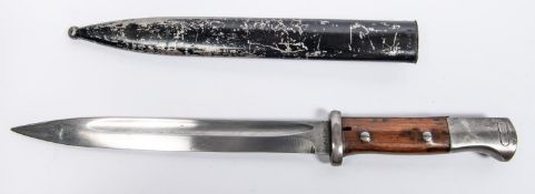 A Third Reich K98 bayonet, with wood grips and flash guard, in its black painted scabbard (non