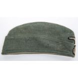 A Third Reich Waffen SS OR's FS cap, woven eagle and swastika. GC (very slight moth damage). £200-